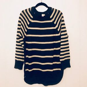 Long sweater with intentional slits up to waist.